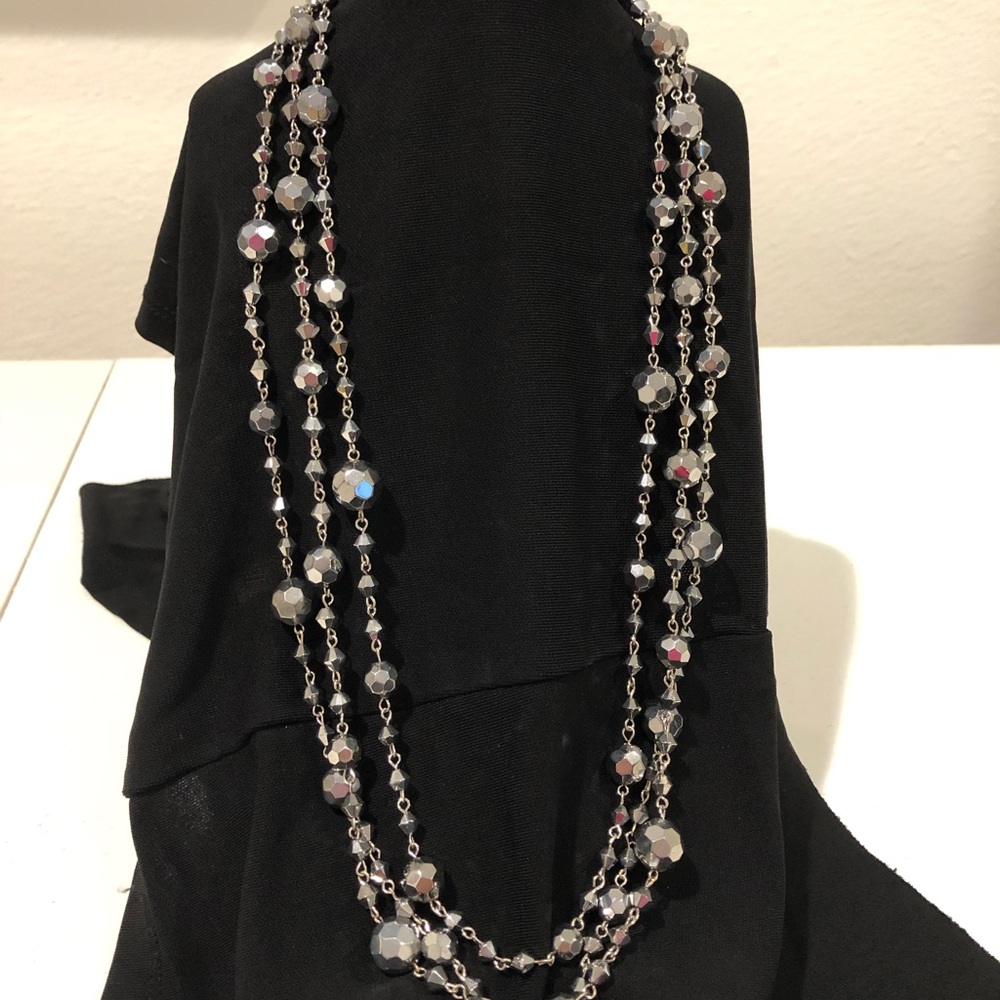 Multi strand Silvertone faceted bead necklace.